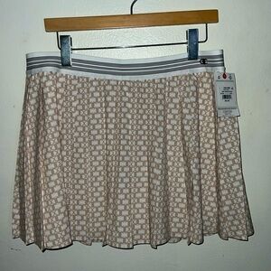 NWT Champion pleated skirt. Size: L. Color: cream and white C logo all o…